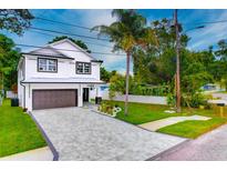 Two-story home with modern design and paver driveway at 1105 Conant Ave, Safety Harbor, FL 34695