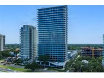 Aerial view of a modern high rise building next to a classic building at 2912 Santiago St # 1201, Tampa, FL 33629