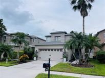 Two-story house with a two-car garage at 2348 Silvermoss Dr, Wesley Chapel, FL 33544