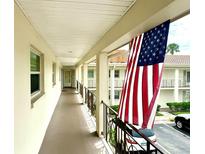 Clean condo hallway with American flag at 19029 Us Highway 19 N # 6-19, Clearwater, FL 33764