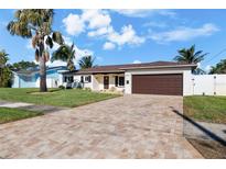 Updated single story home with a paver driveway and two car garage at 537 Dolphin Se Ave, St Petersburg, FL 33705