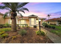 Attractive landscaping around the front entrance at 120 Knollpoint Dr, Sun City Center, FL 33573