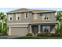 Two story house with gray siding, two car garage at 18215 Metado Dr, Lakewood Ranch, FL 34211