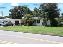 Single-story home with a green lawn and driveway at 2109 58Th S St, Gulfport, FL 33707