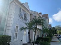 Two story light blue townhome with palm trees at 11335 Grandville Dr, Temple Terrace, FL 33617