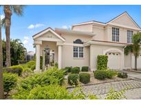 Attractive two-story home with landscaped yard and driveway at 1217 Gorda Cay Ln, Punta Gorda, FL 33950