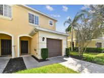 Front exterior of the townhome with garage at 20461 Berrywood Ln, Tampa, FL 33647