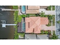 Overhead aerial view of home showing waterfront lot, pool, and the dock at 1233 Acappella Ln, Apollo Beach, FL 33572