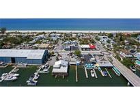 Aerial view of waterfront homes and marina at 103 20Th Ave, St Pete Beach, FL 33706