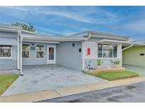 Charming single-story home with a covered entryway and well-maintained landscaping at 250 Rosery Nw Rd # 219, Largo, FL 33770