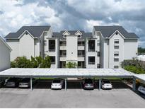 Three-story building with covered parking at 3127 W Sligh Ave # 104B, Tampa, FL 33614
