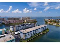 Aerial view of waterfront condo building, showcasing unit location at 5960 30Th S Ave # 502, Gulfport, FL 33707