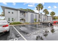 Exterior view of an apartment building with parking lot at 10800 Us Highway 19 N # 112, Pinellas Park, FL 33782