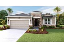 One-story home with stone accents and a two-car garage at 18212 Beach Ranch Ter, Lakewood Ranch, FL 34211