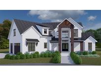 Stunning two-story home with modern farmhouse exterior, landscaping, and attached garage at 8100 Spring Forest Ln, Wesley Chapel, FL 33544