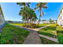 Community with lush landscaping and walkways at 8100 Dr Martin Luther King Jr N St # 208, St Petersburg, FL 33702