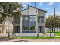 Modern two-unit building with gray and white exterior at 2138 -1 W Beach St, Tampa, FL 33607
