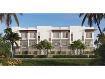 Modern townhomes with balconies and landscaping at 1028 Sunset Point Rd # R10, Clearwater, FL 33755