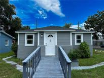 Gray house with white door and walkway at 1650 Prescott S St, St Petersburg, FL 33712