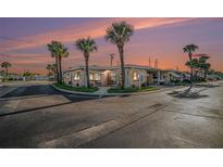 Corner house with palm trees and sunset at 250 Rosery Nw Rd # 351, Largo, FL 33770