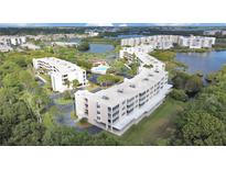 Aerial view of community, showing buildings and lake at 6450 Shoreline Dr # 9405, St Petersburg, FL 33708
