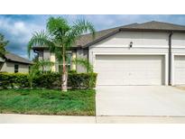 Single Gathering home with two-car garage and landscaping at 14117 Weddington Ter, Hudson, FL 34669