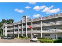 Two-story building with multiple units and ample parking at 2295 Americus E Blvd # 27, Clearwater, FL 33763