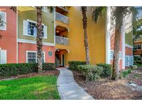 Building exterior with walkway and palm trees at 4207 S Dale Mabry Hwy # 8312, Tampa, FL 33611