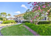 Two-story building with lush landscaping at 29129 S Bay Hollow S Dr # 3213, Wesley Chapel, FL 33543