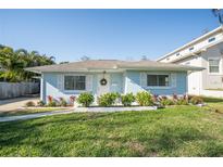 Light blue house with well-manicured lawn and shrubs at 1843 Oregon Ne Ave, St Petersburg, FL 33703