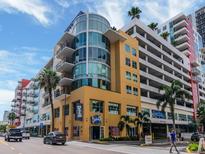 Modern building with parking and street-level businesses at 1208 E Kennedy Blvd # 715, Tampa, FL 33602