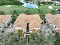 Luxury townhomes with tile roofs near golf course at 1361 Emerald Dunes, Sun City Center, FL 33573