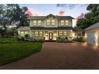 Two-story craftsman home with brick driveway at 2820 N Central Ct, Tampa, FL 33602