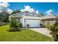 Charming craftsman style home with two car garage at 7906 Wheat Stone Dr, Zephyrhills, FL 33540