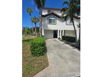 Two-story townhome with a garage and landscaping at 346 Madeira Cir, St Petersburg, FL 33715