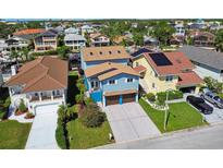 Aerial view of waterfront homes in a residential community at 6241 Bayside Dr, New Port Richey, FL 34652