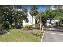 Exterior view of Magnolia Place condo community entrance at 3845 S Lake Dr # 192, Tampa, FL 33614