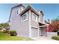 Exterior view of the house with garage at 9550 Tara Cay Ct # 17, Seminole, FL 33776
