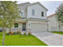 Two-story modern home with stone accents and paved driveway at 3812 W Sevilla St, Tampa, FL 33629