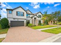 Two-story home with stone accents at 19433 Whispering Brook Dr, Tampa, FL 33647