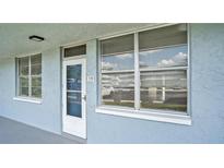 Exterior view of condo building showcasing the entrance and building facade at 4715 Bay Ne St # 119, St Petersburg, FL 33703