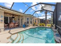 Inviting pool area with covered lanai, perfect for relaxation and entertaining at 825 Regal Manor Way, Sun City Center, FL 33573