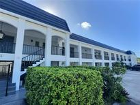 Condo building with updated exterior and landscaping at 8651 10Th N St # 118, St Petersburg, FL 33702