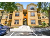 Inviting condo building with well-kept grounds and ample parking at 5608 Pinnacle Heights Cir # 305, Tampa, FL 33624