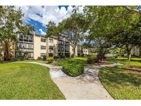 Lakeview of Largo 55+ community with lush landscaping and a welcoming entrance at 14130 Rosemary Ln # 2208, Largo, FL 33774