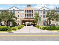 Elegant apartment building with a grand entrance and manicured landscaping at 4221 W Spruce St # 1424, Tampa, FL 33607