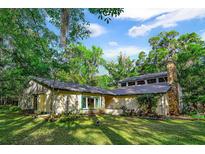 Charming single-story home nestled in a wooded area at 244 Lark Ave, Brooksville, FL 34601