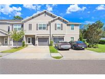 Two-story townhome with attached garage at 10964 Quickwater Ct, Riverview, FL 33569