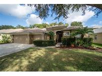 Two-story house with a three car garage at 1926 Rutherford Dr, Dover, FL 33527