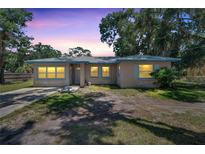 Ranch house exterior with a front yard and driveway at 1404 E Frances Ave, Plant City, FL 33563